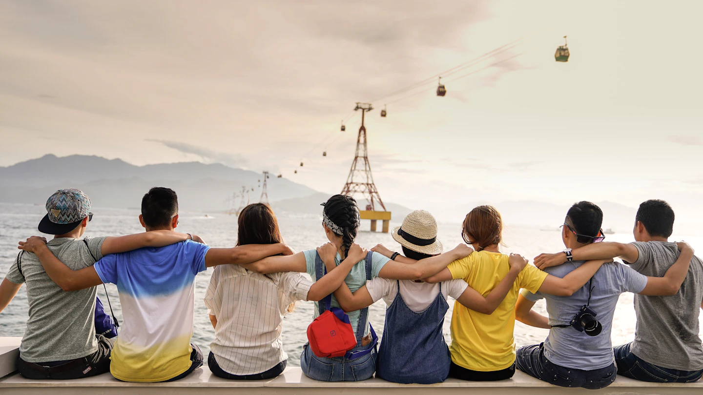 Friends sharing a moment together by the water